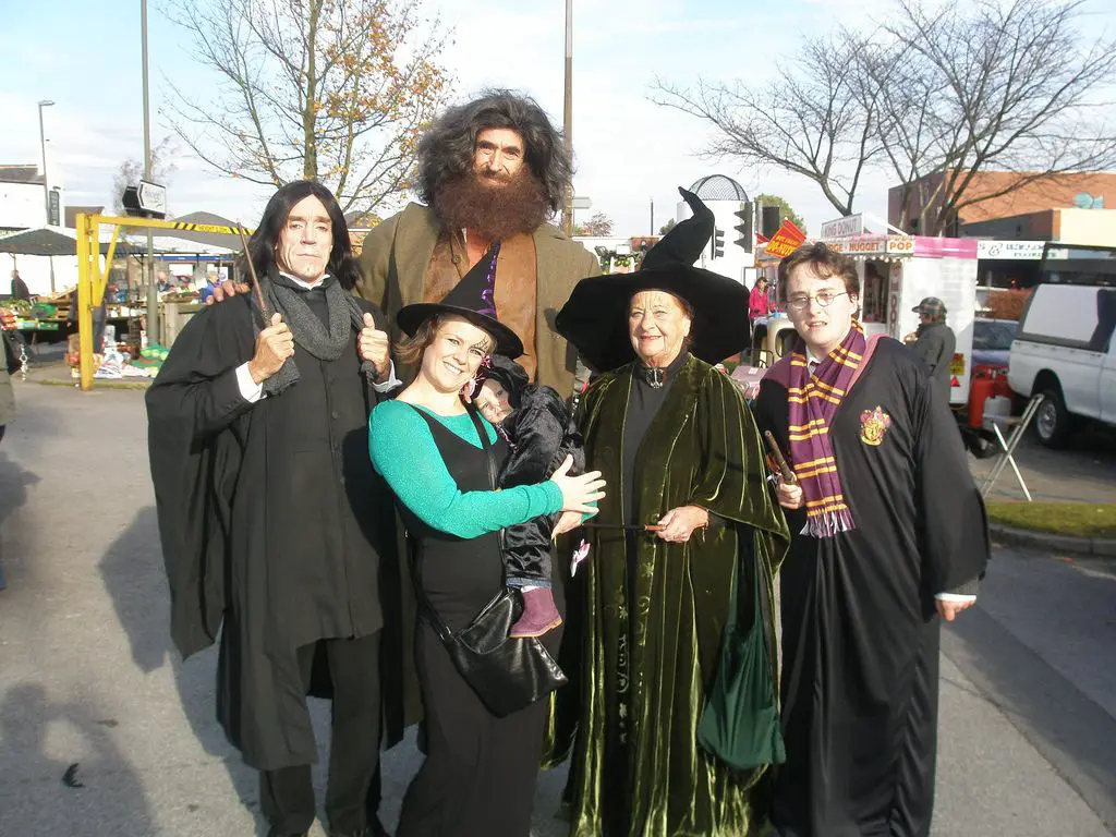 A family cosplaying various characters from Harry Potter.