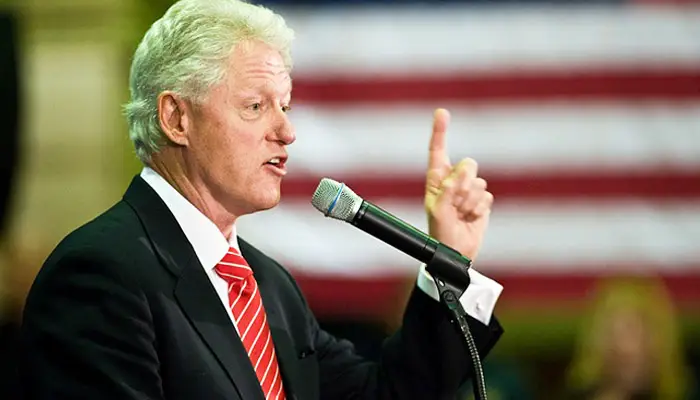 Bill Clinton infront of a mic