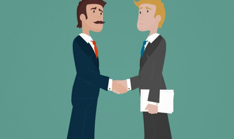 Two businessmen are shaking hands with each other.