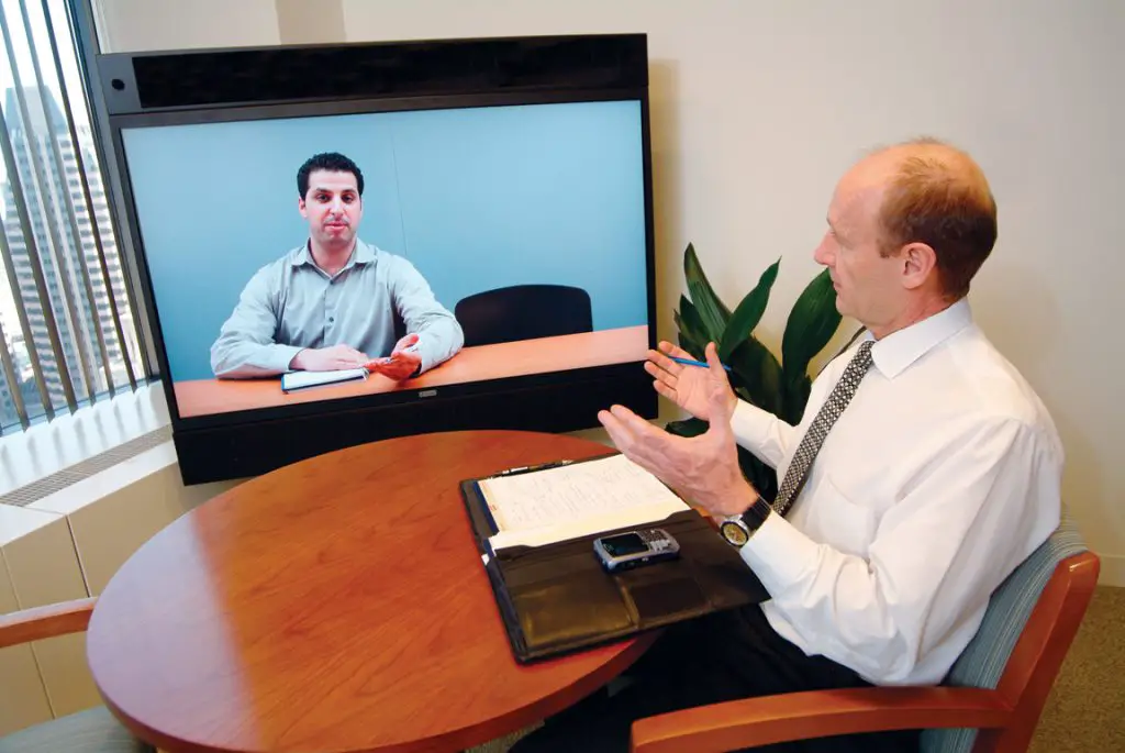 This picture is an example of video conference interview. Two people are having a conversation via video calling app.